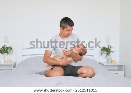 Similar – Man looking his wife and son