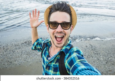 Handsome Caucasian Guy Takes A Selfie At The Beach - People, Lifestyle And Technology Concept