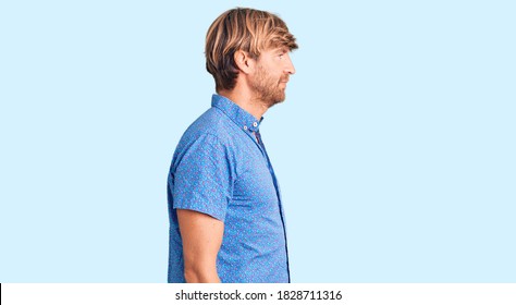 Handsome Caucasian Man With Beard Wearing Casual Clothes Looking To Side, Relax Profile Pose With Natural Face With Confident Smile. 