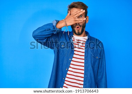 Similar – Man observing something through binoculars