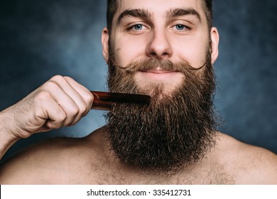 Handsome Caucasian Man Close Up With Funny Mustache Comb Beard And Smile. Horizontal