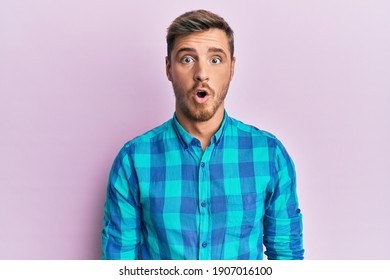 Handsome Caucasian Man Wearing Casual Clothes Scared And Amazed With Open Mouth For Surprise, Disbelief Face 