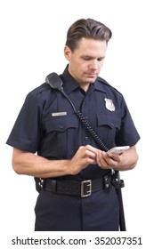 Handsome Caucasian police officer in uniform sending message on cellular smart phone on white background