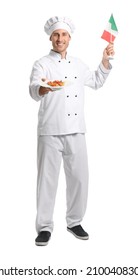 Handsome Chef Holding Plate With Delicious Pasta And Flag Of Italy On White Background