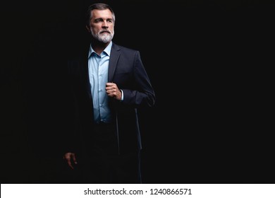 Handsome Confident Mature Business Man Isolated On Black Background