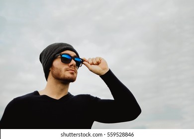 Handsome Cool Young Man With Sunglasses And Cap Wool