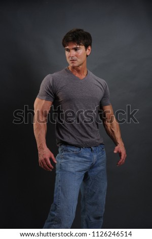 The handsome cop poses for the camera. 
