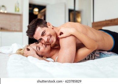 Handsome Couple In Love In Bed Being Sensual