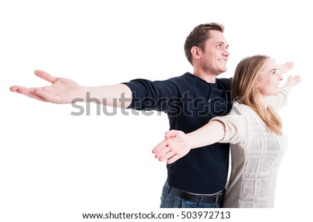 Handsome couple posing like being on Titanic isolated on white background with copy text space