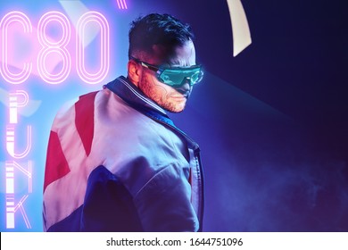 Handsome cyborg man wearing modern clothes and futuristic smart vision glasses. Cyberpunk concept art