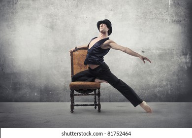 Handsome dancer on a chair