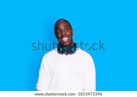 Similar – Young black man listening to music