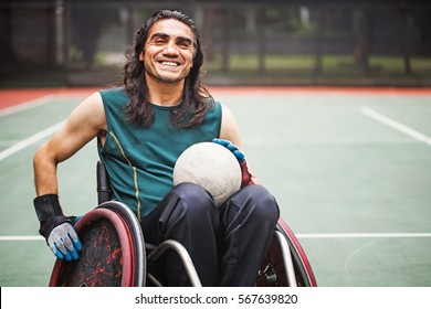 handsome determined disabled rugby player in a wheelchair on a stadium  - Powered by Shutterstock