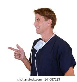 Handsome Doctor Wearing Navy Blue Scrubs Pointing Isolated On White