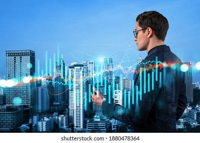 Handsome Eastern Trader Checking Quotes To Forecast The Capital Market Behavior. Concept Of Trading Strategy. Forex Chart. Bangkok. Double Exposure.