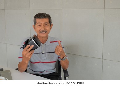 handsome elderly man using Virtual Reality Headset.concept business and technology.