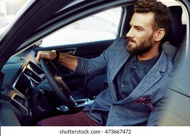 Handsome Elegant Man In A Car