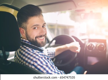 Handsome Elegant Serious Man Drives A Car