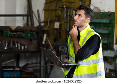 Handsome Engineer Man Or Factory Worker Holding Laptop Computer And Thinking Something For Work