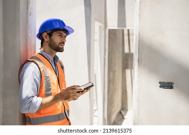 Handsome Engineer Man Using Tablet For Check And Inspection House In Property Projects. House Construction And Home Design Ideas