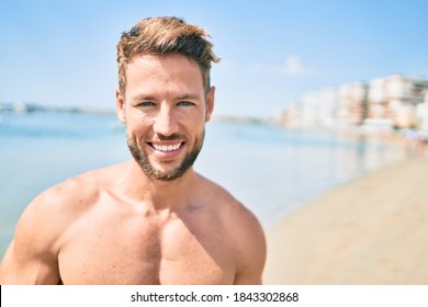 Handsome Fitness Caucasian Man At The Beach On A Sunny Day