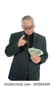 A Handsome and Friendly Father or Business Man holds out money as if he is going to give you your allowance, financial loan or gift of spending money. Dads around the world Lovingly give money freely. - Shutterstock ID 201842434