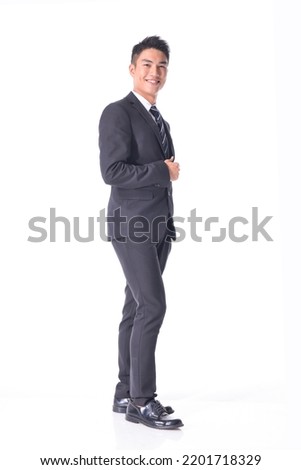 Handsome full body side view young business man
wear formal suit with black tie, with crossed arms, Businessman portrait Isolated on white background

