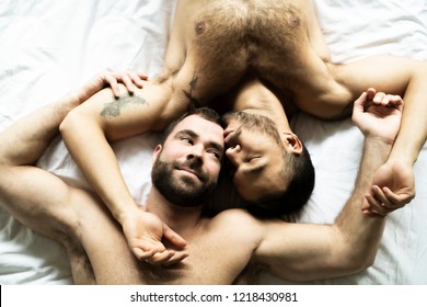 A Handsome Gay Men Couple On Bed Together