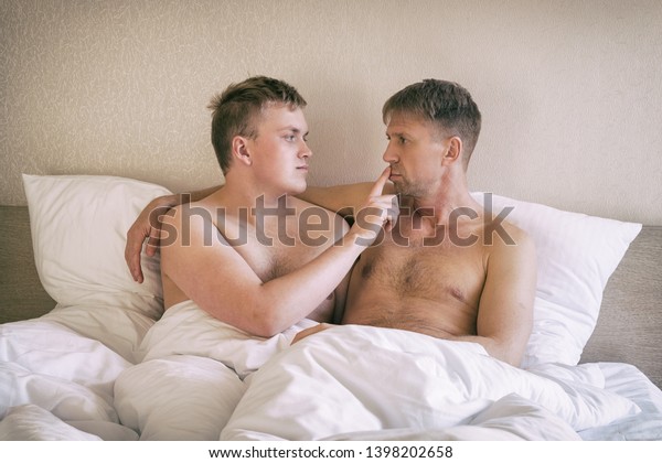 handsome gay men in bed