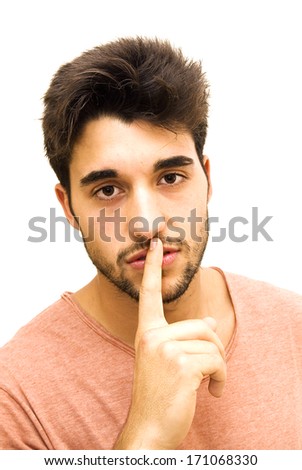 Handsome guy with beard commanding silence on white background