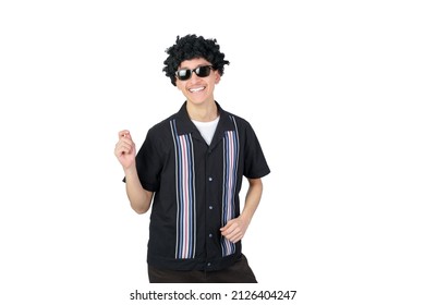 Handsome Guy Dancing Wearing An Afro Wig And Sunglasses. Isolated On White Background. Latin 18-20 Years Old Guy.