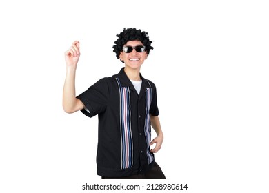 Handsome Guy Dancing Wearing An Afro Wig. Isolated On White Background. Latin 18-20 Years Old Guy.