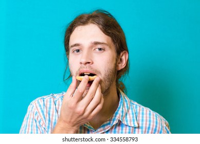 handsome guy eating cookies