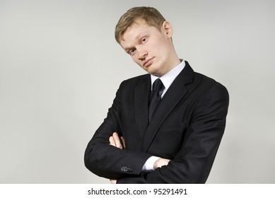 Handsome guy looking at the camera against a background of