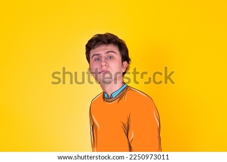 Handsome guy in painted clothes on a yellow background