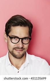 Handsome guy in spectacles in studio