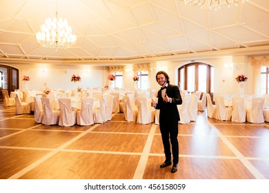 Handsome Happy Groom Posing In Luxury Wedding Reception Hall