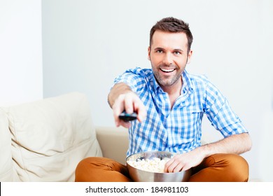 Handsome Happy Man Holding A Remote Control