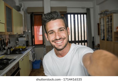 Handsome Happy Smiling Man Taking A Selfie Portrait At Indoor At Home. Concept About Young People, Smartphone, Device Apps And Technology