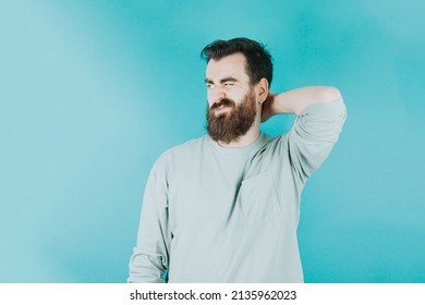 Handsome Hipster Bearded Thinking Something And Trying To Find A Solution Not Satisfied. Young Man Attitude Funny. Blue Tone Color Background, Expression Of Normal People. Mockup Concept With People