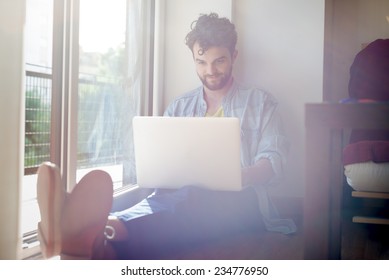 Handsome Hipster Modern Man Designer Working Home Using Laptop At Home