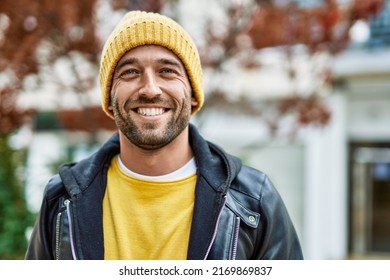 Handsome hispanic man with beard smiling happy outdoors - Powered by Shutterstock