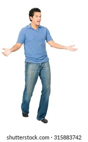 Handsome Hispanic Man In Casual Clothes, Socks, No Shoes, Both Hands, Arms Out To Side, Presenting Himself, Surprise In Tada Body Language Gesture While Looking At Camera