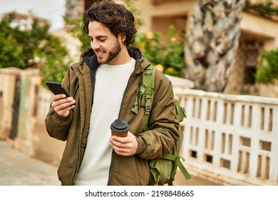 Handsome hispanic man using smartphone at the city