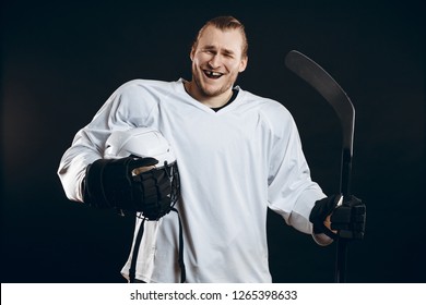 Handsome Hockey Player Smiling At Camera With One Missing Tooth, Asking The Supporters If There Is So Any Interest In Going To That Hockey Game