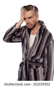 Handsome Hungover Man In A Striped Bathrobe