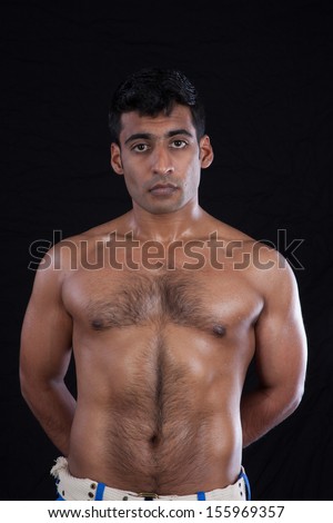 Handsome Indian Man With Bare Chest Showing His Muscles And Body Hair Looking Handsome Indian Man With Bare Chest Showing His Muscles And Body Hair Looking