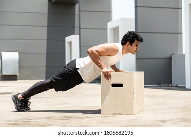 Handsome Indian Sports Man Doing Push Up Exercise Outdoors On Building Rooftop, Home Workout In The Open Air Concept