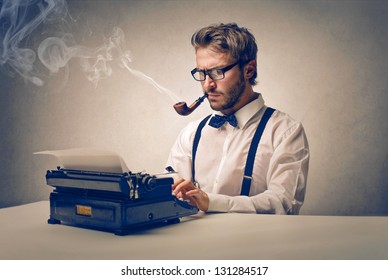 Handsome Journalist Writing With Typewriter