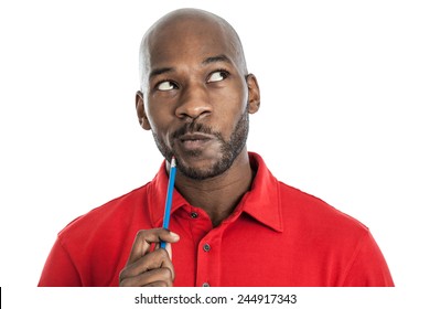 Handsome late 20s black man with pencil on chin thinking isolated on a white background